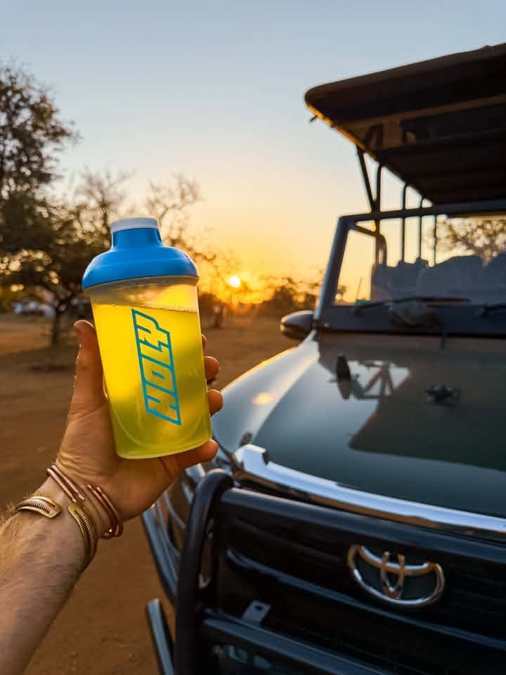 <p>Squad member Alex know Hydration is key when leading a game drive in sunny Kruger National Park of South Africa</p>